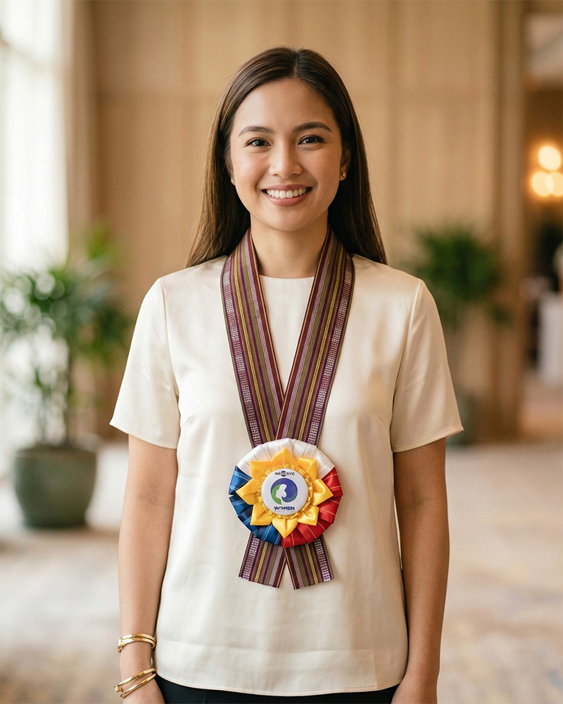 Young woman wearing a handcrafted Rosette Lei with woven yakan necklace and PH-flag inspired rosette centerpiece